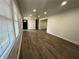 Bright living room with wood floors, recessed lighting, and freshly painted walls at 185 Maple Wood Dr, Lawrenceville, GA 30046