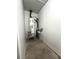 Water heater with piping is visible inside this home's utility room at 185 Maple Wood Dr, Lawrenceville, GA 30046