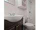 Bathroom featuring a new white shower, dark vanity and a white sink and toilet at 5026 Daniel Mill Rd, Winston, GA 30187
