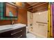 Bathroom featuring a sink, toilet, and shower/tub combo at 5026 Daniel Mill Rd, Winston, GA 30187