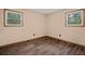 Bedroom with wood-look flooring, neutral walls, and natural light from the window at 5026 Daniel Mill Rd, Winston, GA 30187
