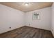 The bedroom boasts laminate wood flooring, neutral paint, and a window for natural light at 5026 Daniel Mill Rd, Winston, GA 30187