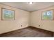 Bedroom featuring two windows and hardwood floors at 5026 Daniel Mill Rd, Winston, GA 30187