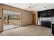 Eat-in kitchen boasts sliding glass doors, stainless steel appliances, and black cabinetry at 5026 Daniel Mill Rd, Winston, GA 30187