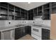 Kitchen featuring black cabinets, stainless appliances, white backsplash and tile floor at 5026 Daniel Mill Rd, Winston, GA 30187