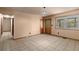 Bright living room showcasing neutral walls, tile floors, and a natural light filled window at 5026 Daniel Mill Rd, Winston, GA 30187