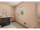 Utility room featuring tile flooring, a small window, and built-in cabinets at 5026 Daniel Mill Rd, Winston, GA 30187