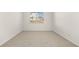 Neutral bedroom with carpeted floors, and bright window at 604 Lobelia Way, Locust Grove, GA 30248