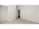 Neutral bedroom with closet and doorway to another room. Good natural light at 604 Lobelia Way, Locust Grove, GA 30248