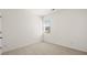 Well-lit bedroom includes neutral carpet and window with great natural light at 604 Lobelia Way, Locust Grove, GA 30248