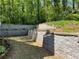 Backyard featuring terraced walls and grass yard at 1241 Baldridge Dr, Lawrenceville, GA 30044