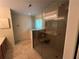 Modern bathroom showcasing a glass shower enclosure, a vanity, and tile flooring at 1241 Baldridge Dr, Lawrenceville, GA 30044