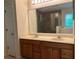 Bathroom featuring a double sink vanity, a shower, and a soaking tub at 1241 Baldridge Dr, Lawrenceville, GA 30044