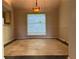 Dining area with tile flooring, a large window, and neutral paint, ready for your personal touch at 1241 Baldridge Dr, Lawrenceville, GA 30044