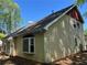 Angled rear exterior shot with light siding and a shingled roof at 1241 Baldridge Dr, Lawrenceville, GA 30044