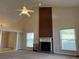 Spacious living room featuring vaulted ceilings, a brick fireplace, and two large windows at 1241 Baldridge Dr, Lawrenceville, GA 30044