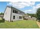 Nice backyard with a covered patio perfect for outdoor dining and entertaining with a well-manicured lawn at 160 Avery Landing Way, Canton, GA 30115