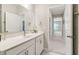 Bright bathroom with marble floors and white cabinets at 160 Avery Landing Way, Canton, GA 30115