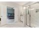 Bright bathroom features a glass shower with a marble tile surround at 160 Avery Landing Way, Canton, GA 30115