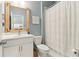 Cozy bathroom with white vanity and farmhouse-style mirror at 160 Avery Landing Way, Canton, GA 30115