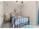 Comfortable bedroom features a decorative unicorn, plush bedding, and soft carpeting at 160 Avery Landing Way, Canton, GA 30115