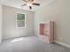 Bright bedroom with a ceiling fan and a built-in shelf at 160 Avery Landing Way, Canton, GA 30115
