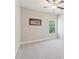 Bright bedroom with neutral walls, carpet flooring, ceiling fan, and a window with a view at 160 Avery Landing Way, Canton, GA 30115