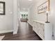 Elegant entryway with wood floors, a white sideboard, and decor at 160 Avery Landing Way, Canton, GA 30115