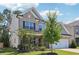 Beautiful two-story home featuring brick and siding accents, a well-kept lawn, and mature trees at 160 Avery Landing Way, Canton, GA 30115