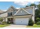 Attractive home featuring brick and siding accents, a well-kept lawn, and a two-car garage at 160 Avery Landing Way, Canton, GA 30115