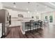 Modern kitchen with stainless steel appliances, granite countertops, and an island with barstool seating at 160 Avery Landing Way, Canton, GA 30115