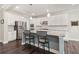 Modern kitchen with stainless steel appliances, granite countertops, and an island with barstool seating at 160 Avery Landing Way, Canton, GA 30115