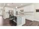 Bright kitchen with granite countertops, white cabinetry and stainless steel appliances at 160 Avery Landing Way, Canton, GA 30115