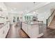 Modern, open-concept kitchen featuring a large island with granite countertops and stainless steel appliances at 160 Avery Landing Way, Canton, GA 30115