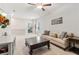 Open-concept living room features a sofa, coffee table, and offers flexible layout options at 160 Avery Landing Way, Canton, GA 30115