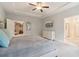 Spacious main bedroom with trey ceiling, fan, and large windows at 160 Avery Landing Way, Canton, GA 30115