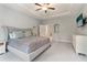Spacious main bedroom with trey ceiling, fan, and large windows at 160 Avery Landing Way, Canton, GA 30115