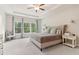 Spacious main bedroom features trey ceiling, fan, large windows, and a sitting area at 160 Avery Landing Way, Canton, GA 30115