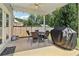 Cozy covered patio featuring outdoor dining furniture, ideal for relaxing and entertaining at 160 Avery Landing Way, Canton, GA 30115