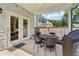 Charming covered patio with outdoor dining, offering a perfect spot for al fresco meals at 160 Avery Landing Way, Canton, GA 30115