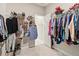 Well-organized walk-in closet featuring shelves and hanging racks for easy storage and access at 160 Avery Landing Way, Canton, GA 30115