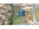 Bird's eye view of the property highlighting the backyard, mature trees, and the home's architectural details at 500 Katherines Cv, Mcdonough, GA 30253