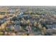 Beautiful aerial view of a suburban neighborhood featuring homes near a tranquil lake at 500 Katherines Cv, Mcdonough, GA 30253