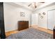 Bedroom with wood floors, a dresser, and a window at 500 Katherines Cv, Mcdonough, GA 30253