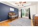 Bedroom with wood floors, a crib, and large windows at 500 Katherines Cv, Mcdonough, GA 30253