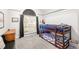 Cozy bedroom with a bunk bed, large window, and neutral-toned carpet at 500 Katherines Cv, Mcdonough, GA 30253