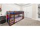 ' bedroom with bunk beds, closet, and neutral carpet at 500 Katherines Cv, Mcdonough, GA 30253