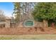 Stone sign for the Emerald Pointe community is surrounded by grass and trees at 500 Katherines Cv, Mcdonough, GA 30253