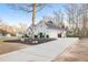 Charming home featuring attached garage, and long concrete driveway with basketball hoop at 500 Katherines Cv, Mcdonough, GA 30253