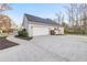 Attached garage with long concrete driveway at 500 Katherines Cv, Mcdonough, GA 30253